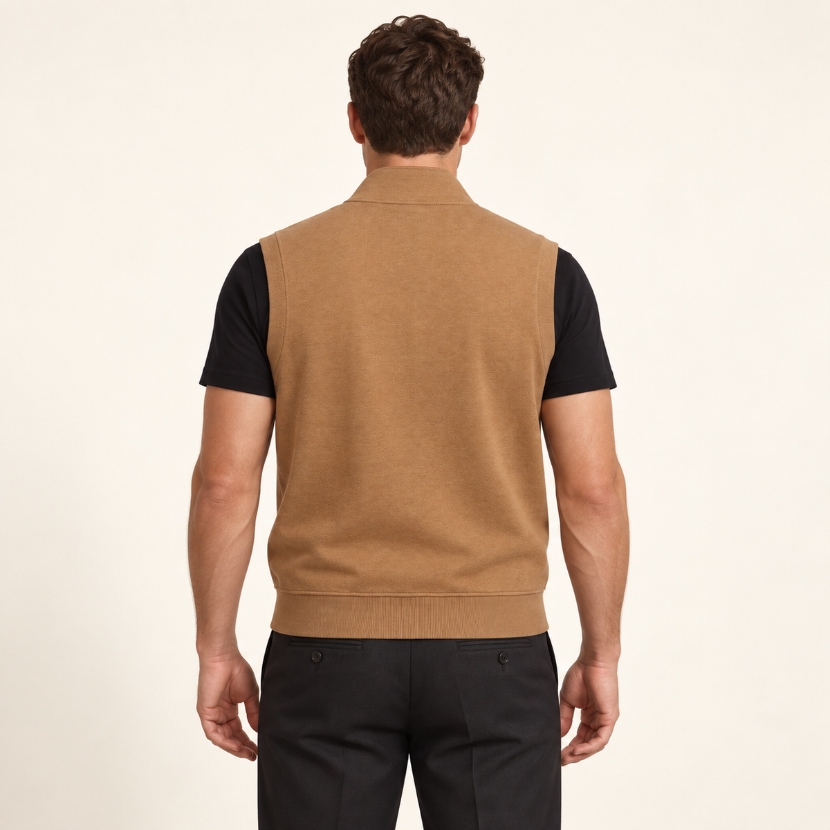 Model wearing the camel Essential Heavyweight Vest, back view