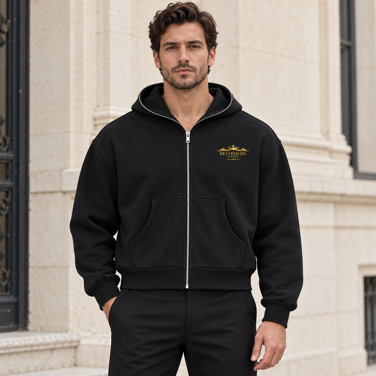 Model wearing the black Fleeced Full-Zip Boxy Hoodie outdoors