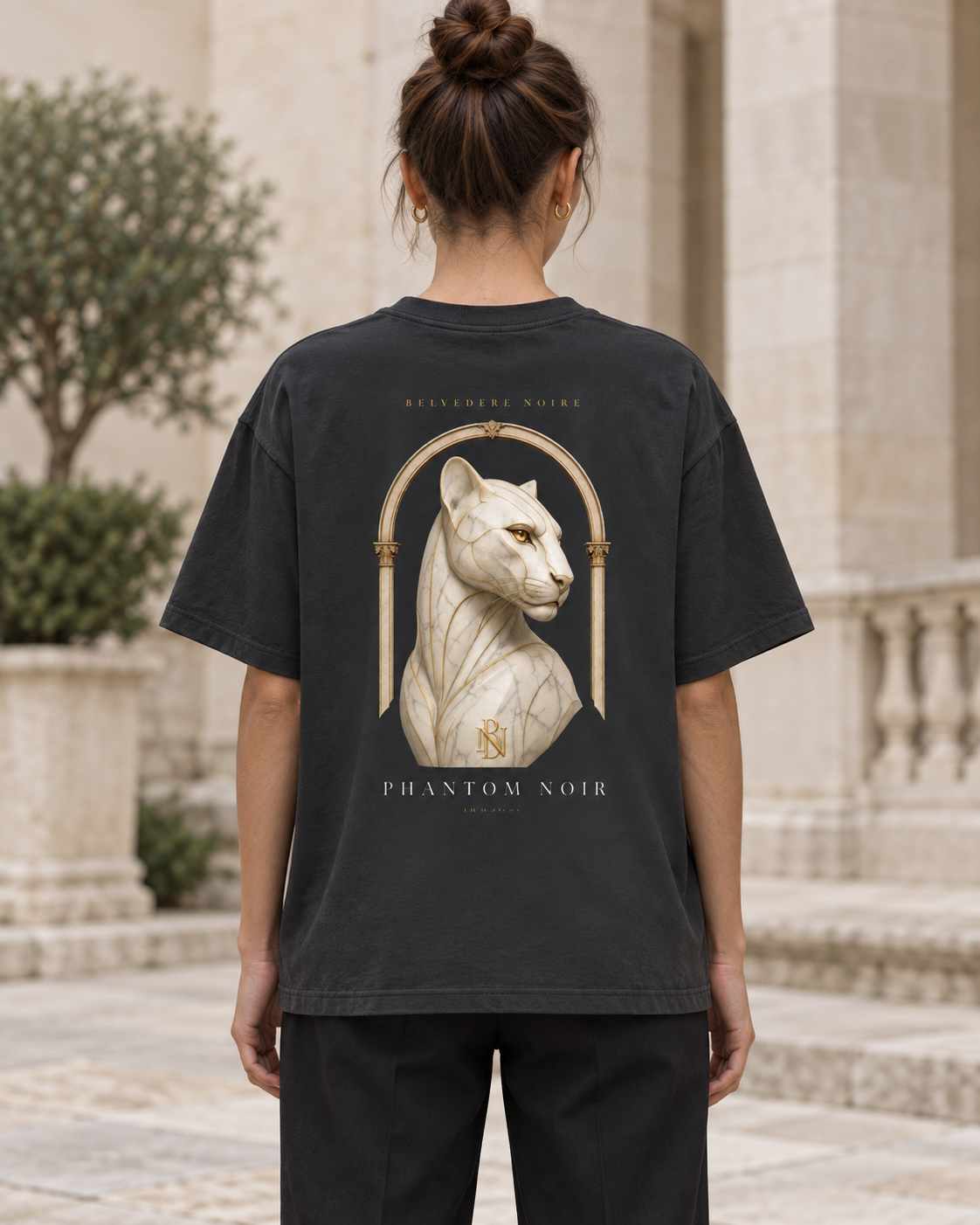 Model wearing the black Classic Loose Boxy Tee, back view