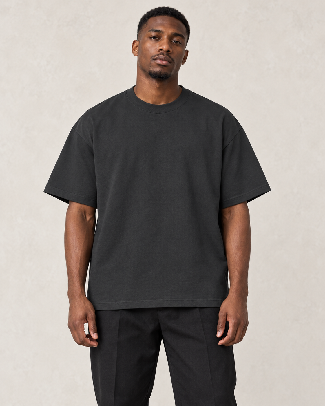 Model wearing the black Classic Loose Boxy Tee, front view