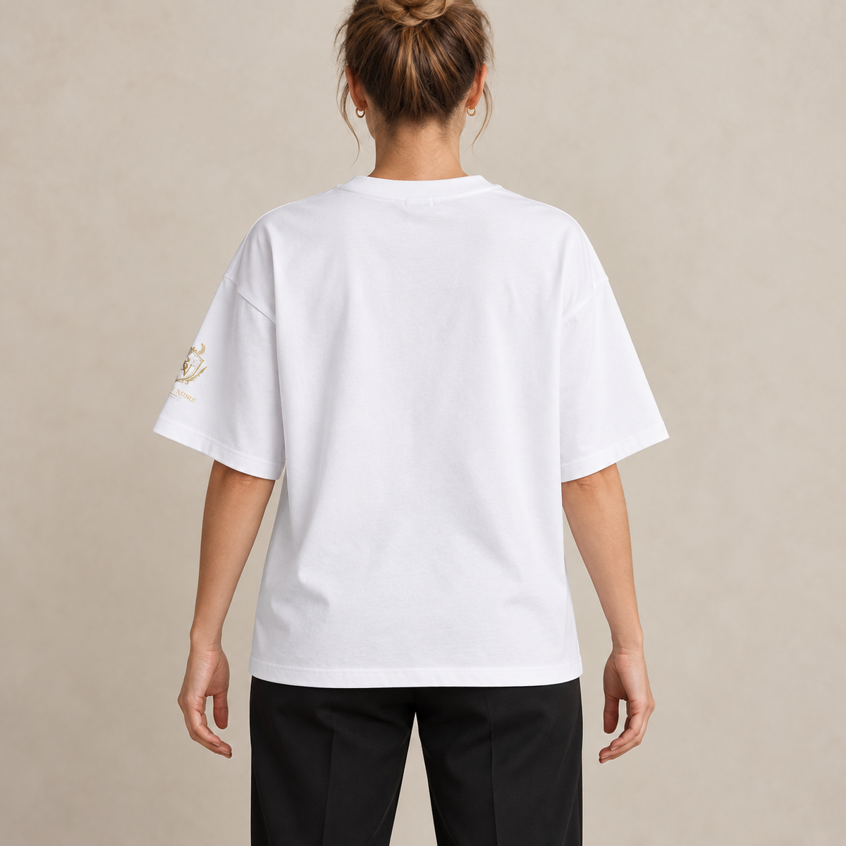 White Boxy Oversized T-Shirt with gold sleeve emblem, back view