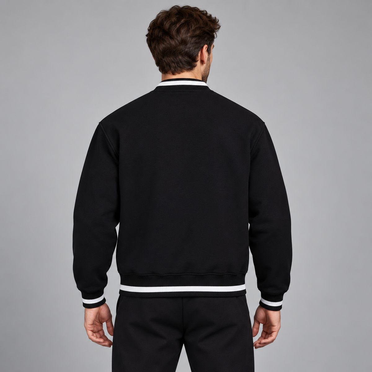 Model wearing the black Contrast Piping Zip Bomber Jacket, back view