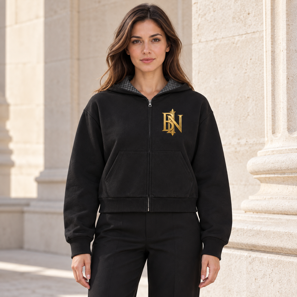 Model wearing the black Contrast Plaid Boxy Zip Hoodie outdoors