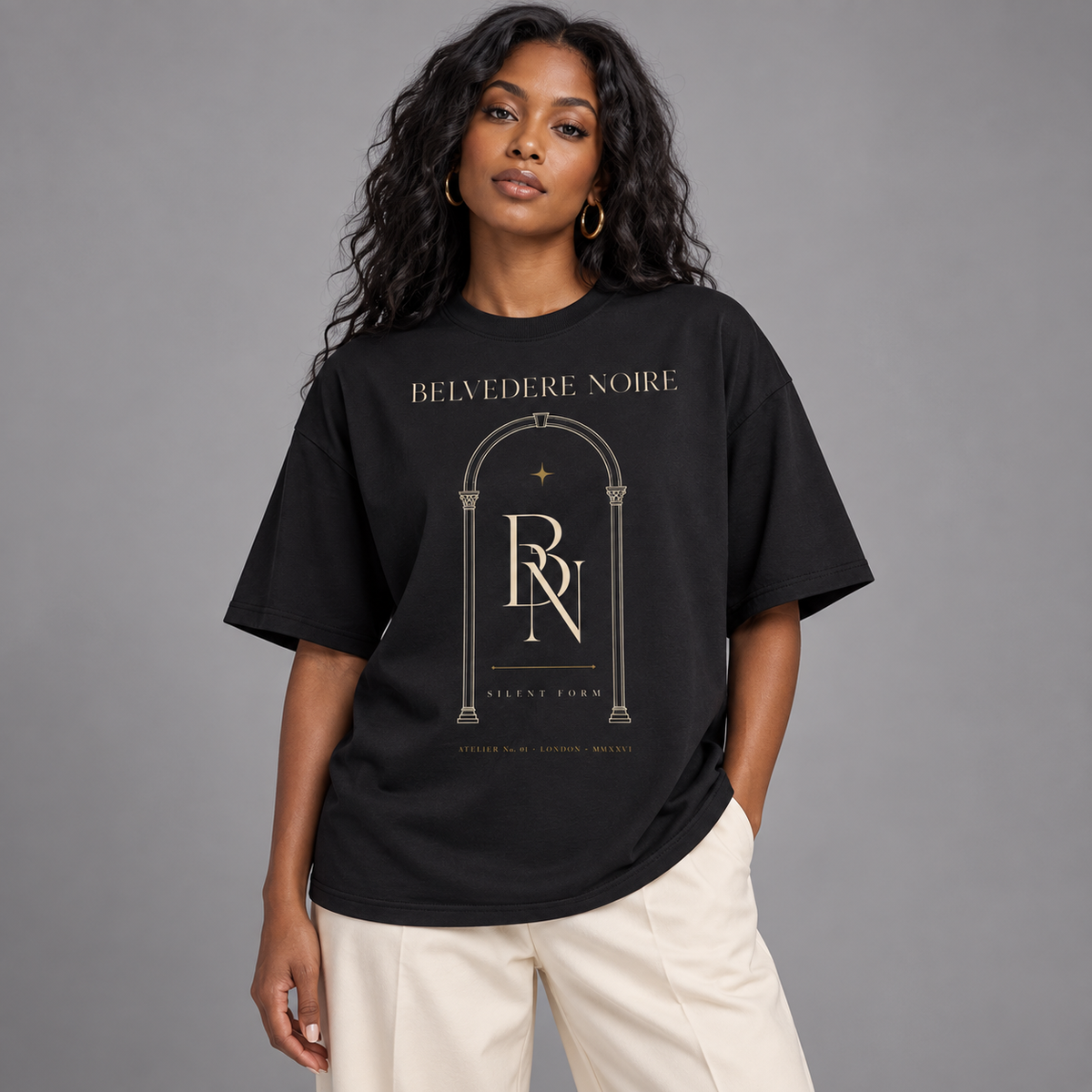 Model wearing the black Silent Form oversized T-shirt, front view