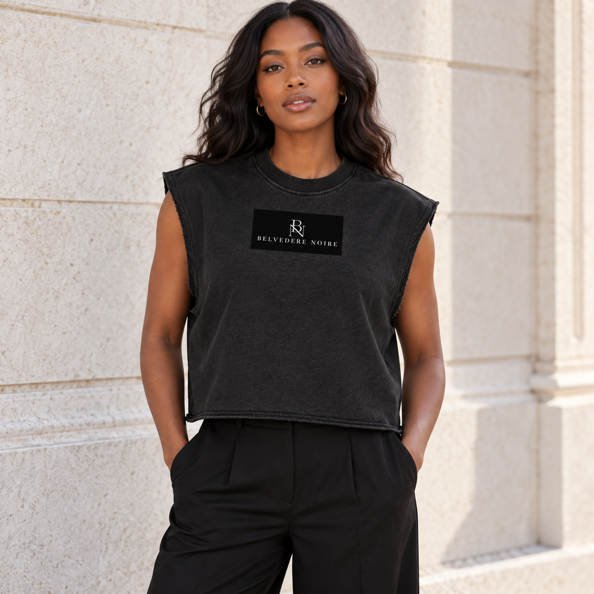Model wearing the black French Terry Boxy Tank Top outdoors
