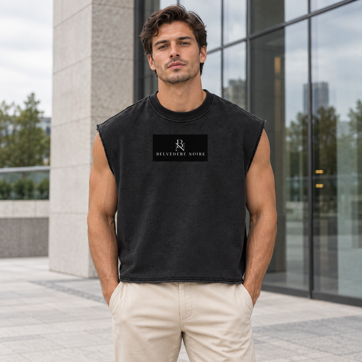 Model wearing the black French Terry Boxy Tank Top outdoors, front view
